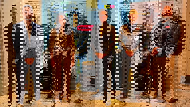 People standing in front of a modern exhibition display