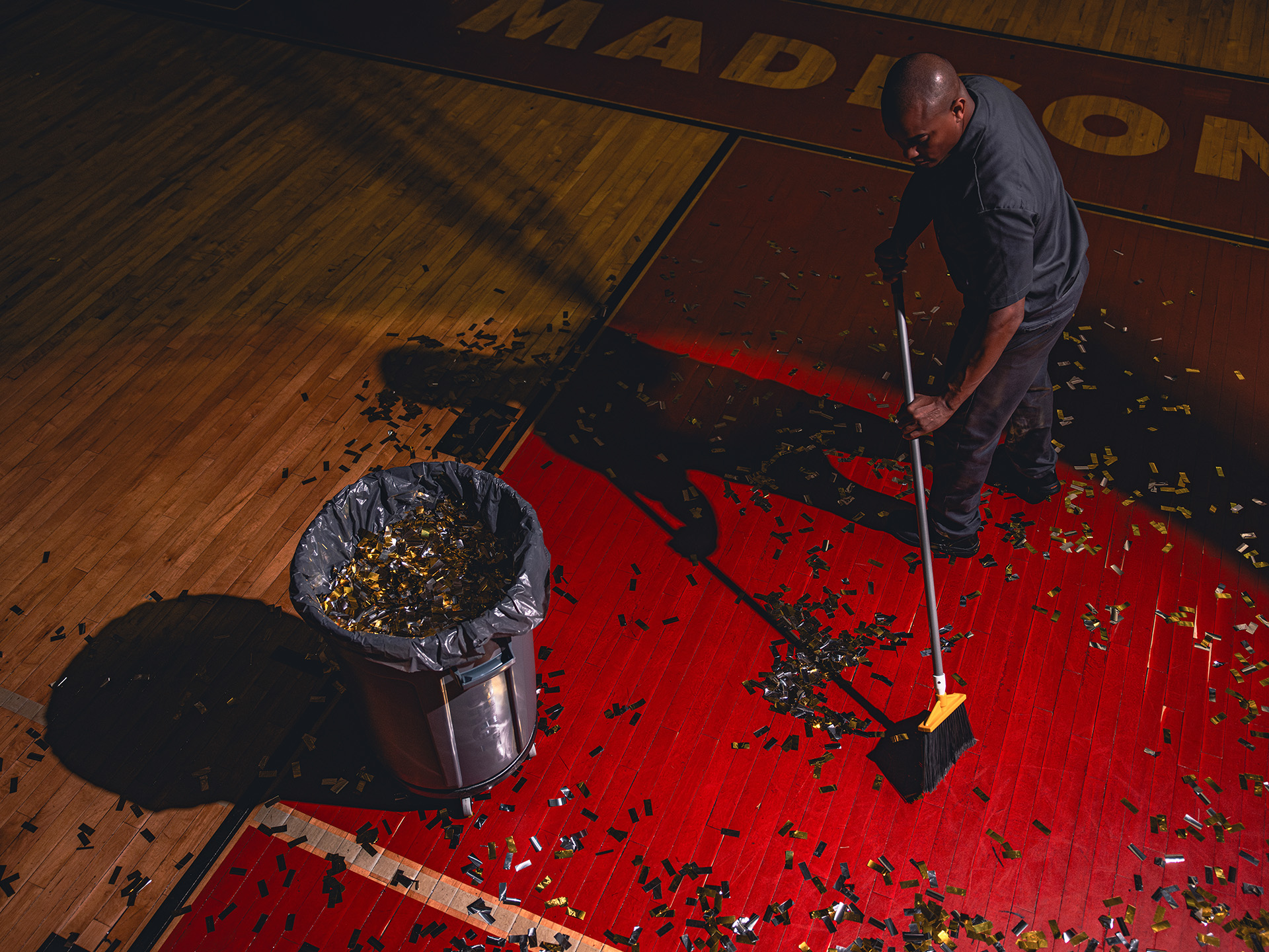 Man sweeping floor.