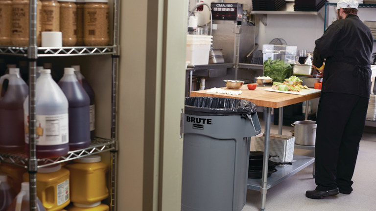 Chef preparing vegetables on a kitchen counter